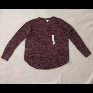 A women’s Large Sweater, never worn before.